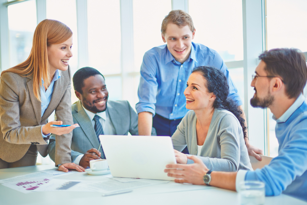 Social Media Management 3 executives joking laughing office